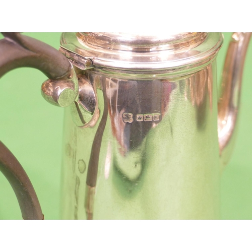 343 - A George V Silver Coffee Pot having ebonised scroll shaped handle, sweeping base, Sheffield 1916, ma... 