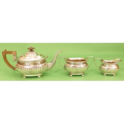 345 - An Edward VII 3 Piece Silver Tea Service having half embossed reeded decoration, on bun feet compris... 