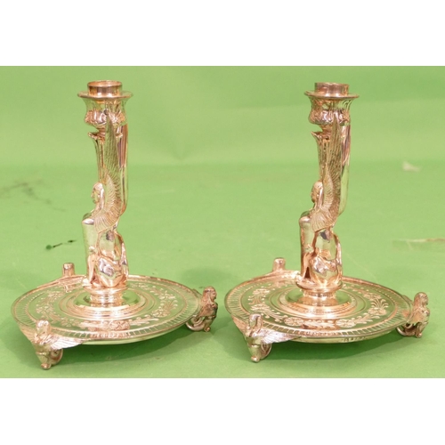 361 - A Pair of Elkington Silver Plated Candlesticks in form of winged, seated animal figures on round bas... 