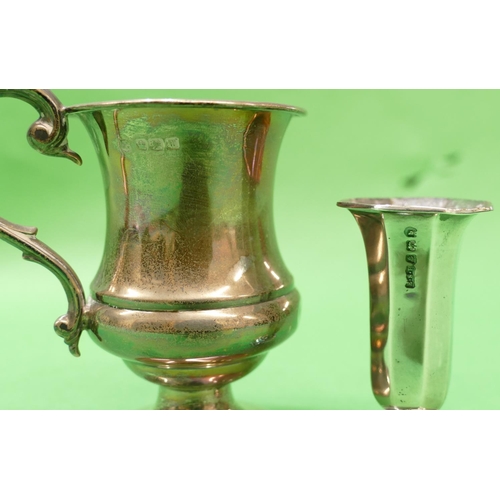 367 - A Sheffield Silver Round Bulbous Trumpet Shaped Christening Mug having scroll handle on round sweepi... 