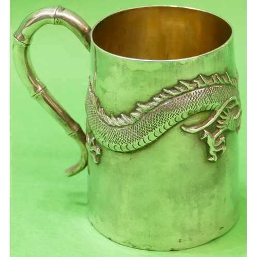 370 - A Chinese Silver Coloured Metal Mug having raised dragon motif, stamped WH90, 8.5cm high, 4.1oz.