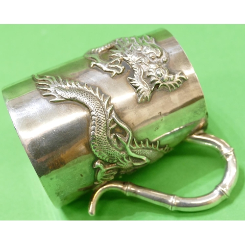 370 - A Chinese Silver Coloured Metal Mug having raised dragon motif, stamped WH90, 8.5cm high, 4.1oz.