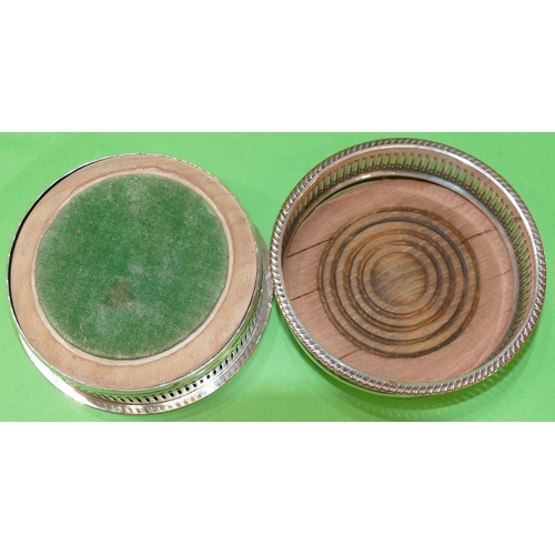 372 - A Pair of Silver Plated Wine Coasters having gadroon rims, wooden centres, 13.8cm diameter.