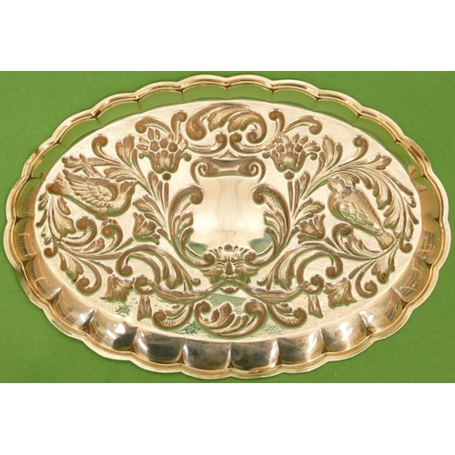 396 - A Continental Silver Coloured metal Oval Pin Dish having embossed bird, floral, leaf and scroll deco... 