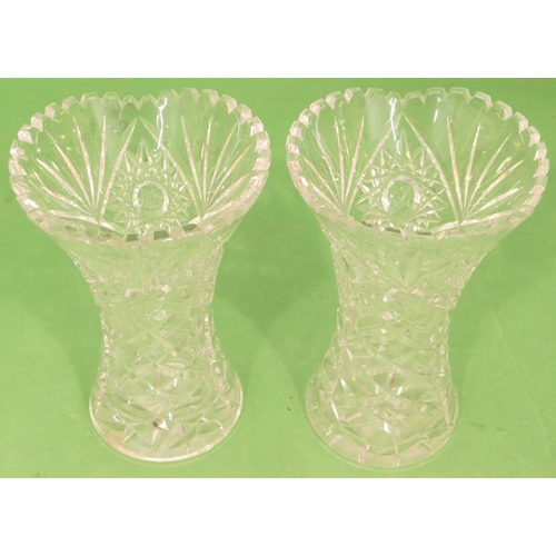 41 - A Pair of Cut Glass Round Bulbous Trumpet Shaped Vases having tooth cut rims, 26cm high (2).