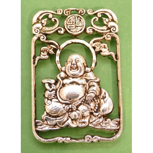 423 - An Eastern Silvered Rectangular Shaped Pendant having pierced seated buddha motif, 4.5cm high.