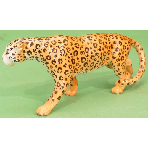 44 - A Beswick Figure of a leopard, 30.5cm long.