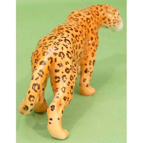 44 - A Beswick Figure of a leopard, 30.5cm long.