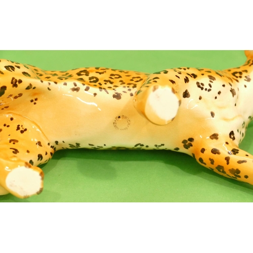 44 - A Beswick Figure of a leopard, 30.5cm long.