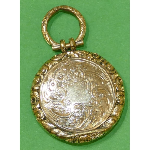 445 - A Victorian Gold Circular Locket having bevelled glass front, with all over chased, floral, leaf and... 