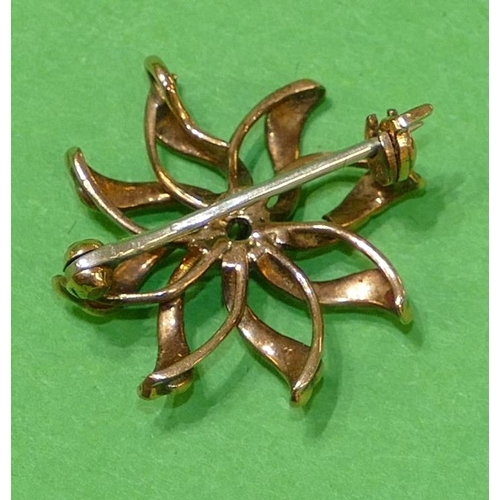 450 - A Gold Star Brooch set with centre diamonds surrounded by half pearls (8 half pearls missing) 2.3cm ... 