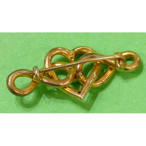 451 - A Victorian 9ct Gold Heart Shaped and Entwined Brooch having centre turquoise, 4.2cm wide, 2.9g gros... 