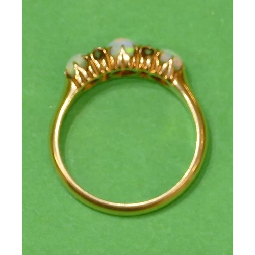 452 - An 18ct Gold Ladies Ring set with 3 centre opals, interspersed by 4 small diamonds, size N.