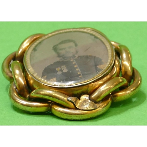 456 - A Victorian Gold Plated Brooch having entwined rim with centre depicting shoulder length portrait of... 