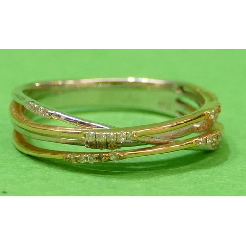 461 - An 18ct White and Yellow Gold Ladies Ring having 4 strands each mounted with various small diamonds,... 