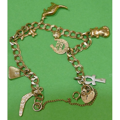 462 - A 9ct Gold Charm Bracelet having padlock clasp, mounted with 8 gold and 1 silver charm, overall weig... 