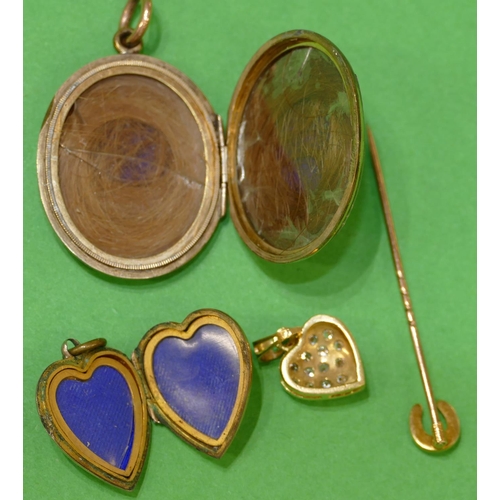 535 - A Gold Front and Back Oval Locket, a heart shaped locket, another heart shaped pendant and a gold st... 