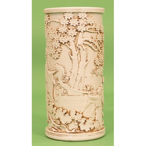 54 - An Oriental Cylindrical Brush Pot on white ground having raised Oriental figure, animal and tree dec... 