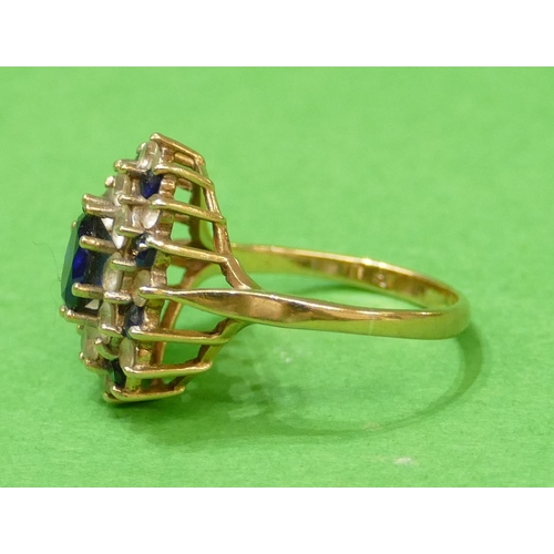 567 - A 9ct Gold Ladies Cluster Ring set with sapphires and clear stones, size N/O, 3.7g.