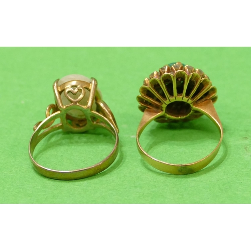 569 - A Gold Cluster Ring set with centre green stone surrounded by clear stones, size K/L, also another g... 