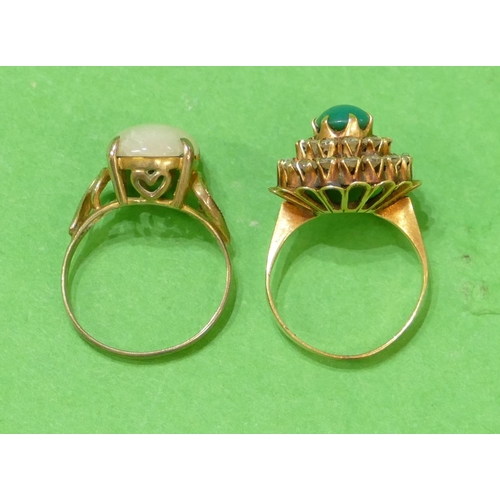 569 - A Gold Cluster Ring set with centre green stone surrounded by clear stones, size K/L, also another g... 