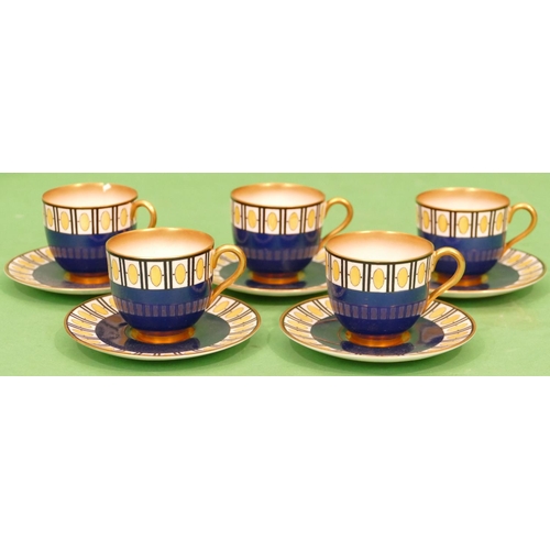 6 - A Set of 5 Royal Worcester Coffee Cups and Saucers on blue and white ground having yellow and gilt d... 