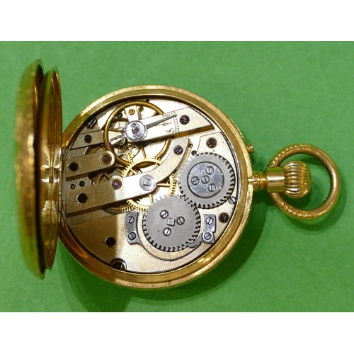 605 - An 18ct Gold Fob Watch having white enamel dial with Roman numerals with all over chased floral, lea... 