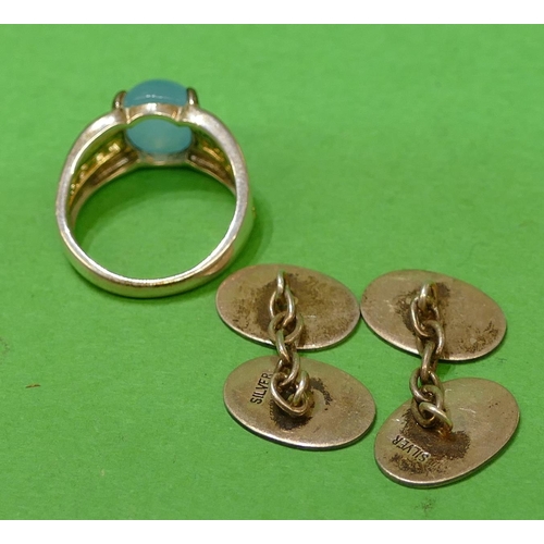 628 - A Pair of Gentleman's Oval Silver Cufflinks and a silver ladies ring set with pale blue stone (3).