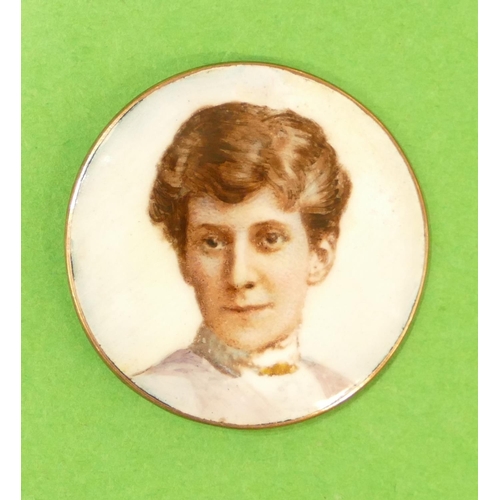 633 - A Circular Gold Panel having enamelled shoulder length portrait of a lady, 3.2cm diameter.