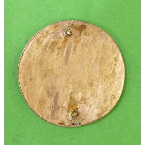 633 - A Circular Gold Panel having enamelled shoulder length portrait of a lady, 3.2cm diameter.