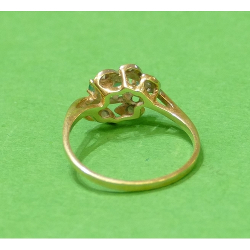 647 - A 14ct Gold Ladies Ring set with 3 centre stones surrounded by 4 small diamond chips, size O, 2.2g g... 