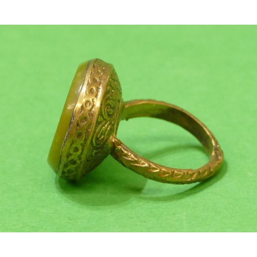 674 - A Roman Style Gilt Circular Ring having horse motif, size Q.