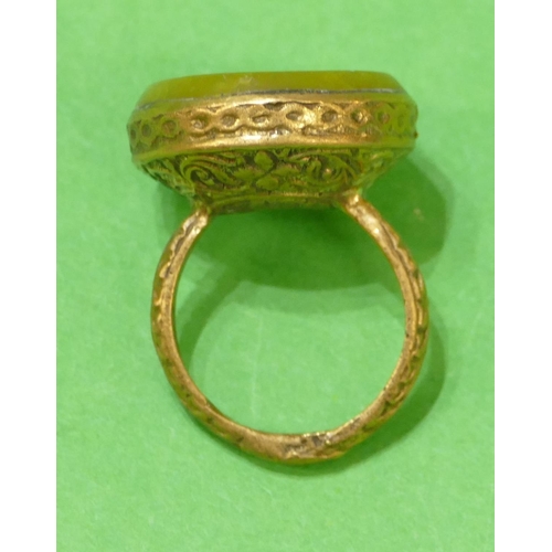 674 - A Roman Style Gilt Circular Ring having horse motif, size Q.