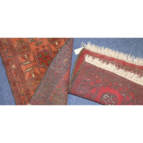 704 - An Afghan Prayer Rug on red ground having various medallions, 84cm x 52cm, also a smaller Afghan pra... 