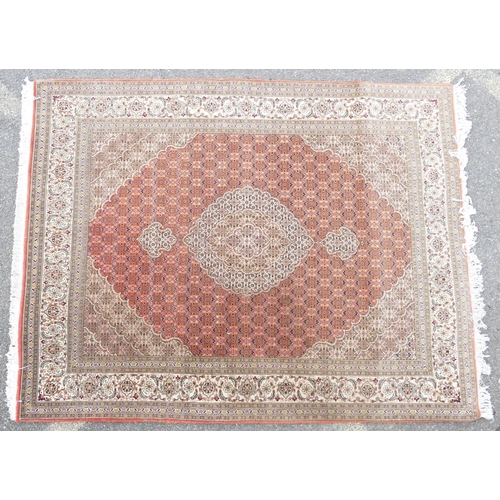 712 - A Persian Style Rug on cream ground having centre medallion, 1m 98cm x 1m 55cm.