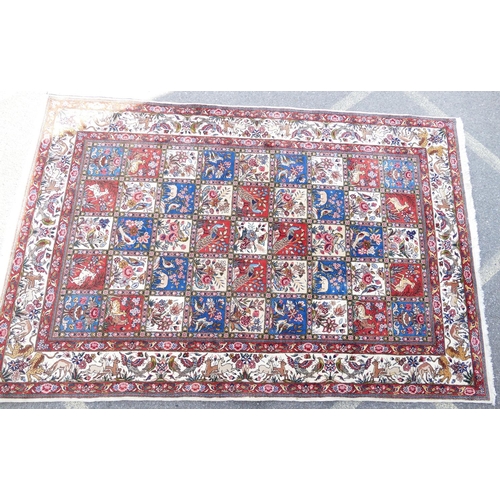 714 - A Wool Carpet on white, red and blue ground having all over bird decoration, 3m 15cm x 2m 6cm.