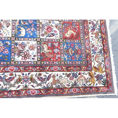 714 - A Wool Carpet on white, red and blue ground having all over bird decoration, 3m 15cm x 2m 6cm.