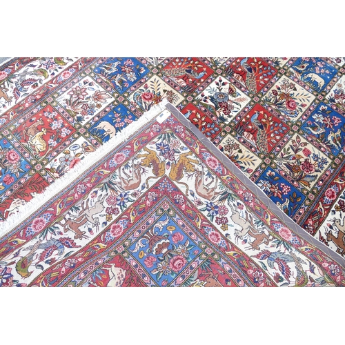 714 - A Wool Carpet on white, red and blue ground having all over bird decoration, 3m 15cm x 2m 6cm.