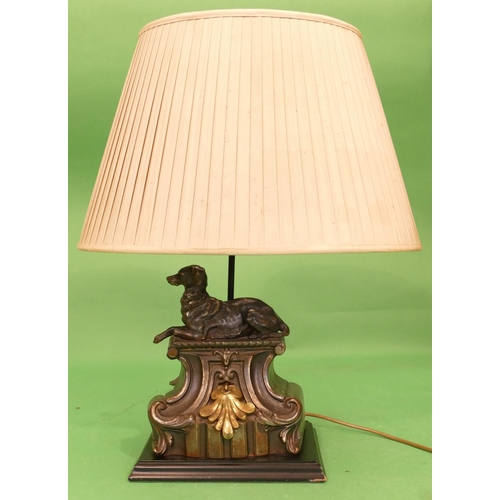 715 - A Good Quality Spelter Table Lamp in form of a relaxing dog on scallop shaped platform with shade an... 