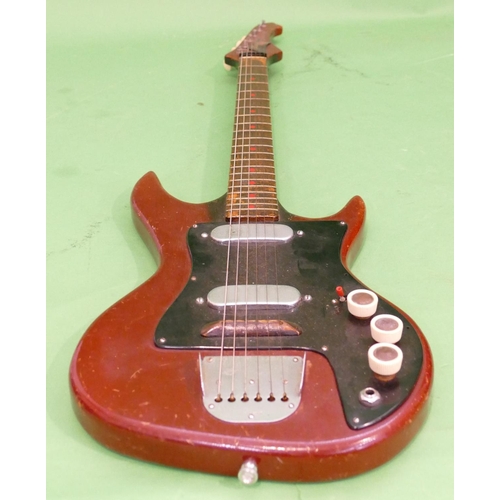 717 - A Fenton Weill Electric Guitar having red lacquer decoration.