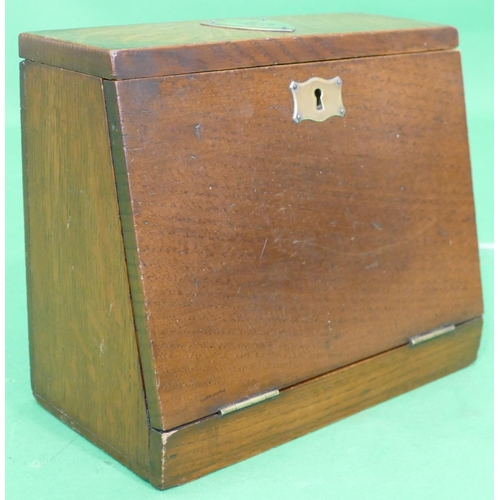 727 - A Victorian Oak Stationery Box having hinge lid and full front, stamped Steele & Co with red leather... 