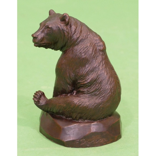 744 - A Composition Model of a seated bear, 11.5cm high.