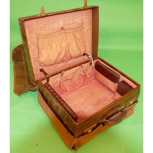 753 - A Crocodile Travelling Case with outer cover, hinge lid enclosing part fitted interior, 46.5cm wide.