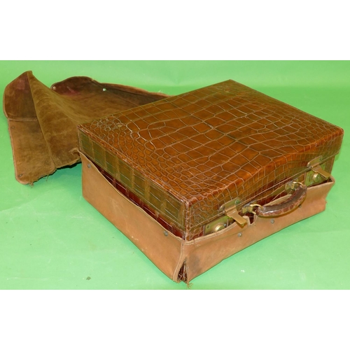 753 - A Crocodile Travelling Case with outer cover, hinge lid enclosing part fitted interior, 46.5cm wide.