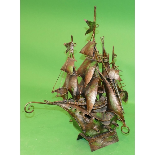 756 - An Arts and Crafts Style Metal Model of a galleon, 59cm high.