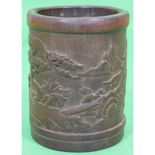 762 - A Bamboo Cylindrical Brush Pot having raised figure and landscape decoration, 16.5cm high.