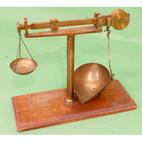 780 - A Brass Set of Balance Scales on mahogany rectangular shaped base, 32cm high.