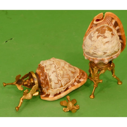 791 - A Pair of Conch Shell Table Lamps having carved figure, chariot, floral and scroll decoration on gil... 