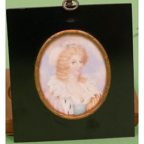 802 - An Oval Miniature shoulder length portrait of a young lady in ebonised frame, 6cm x 7cm.