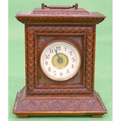 818 - An Oak Alarm Mantle Clock having all over carved decoration, cream dial with Arabic numerals, 19.5cm... 